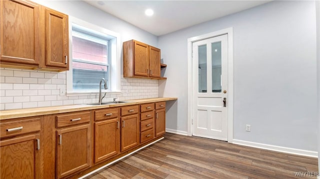 63 Briggs Ave, Buffalo, NY 14207 - kitchen featuring tasteful backsplash, dark wood-style flooring, brown cabinetry, butcher block counters, and recessed lighting
