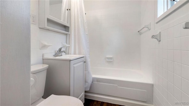 63 Briggs Ave, Buffalo, NY 14207 - bathroom with tile walls, shower / tub combo with curtain, and vanity