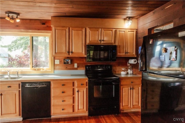 3271 Lanning Rd, Spafford, NY 13152 - kitchen featuring black appliances, wooden ceiling, dark wood-type flooring, wood walls, and light countertops