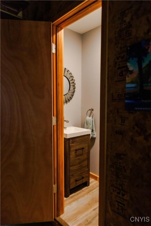 3271 Lanning Rd, Spafford, NY 13152 - bathroom featuring wood finished floors and vanity