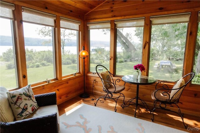 3271 Lanning Rd, Spafford, NY 13152 - sunroom / solarium with plenty of natural light, wood finished floors, vaulted ceiling, wooden walls, and wood ceiling