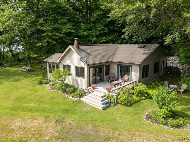 3271 Lanning Rd, Spafford, NY 13152 - back of property featuring a chimney, roof with shingles, and a lawn
