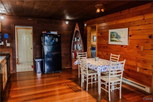 3271 Lanning Rd, Spafford, NY 13152 - dining area with wood walls, wooden ceiling, dark wood-style floors, and baseboard heating