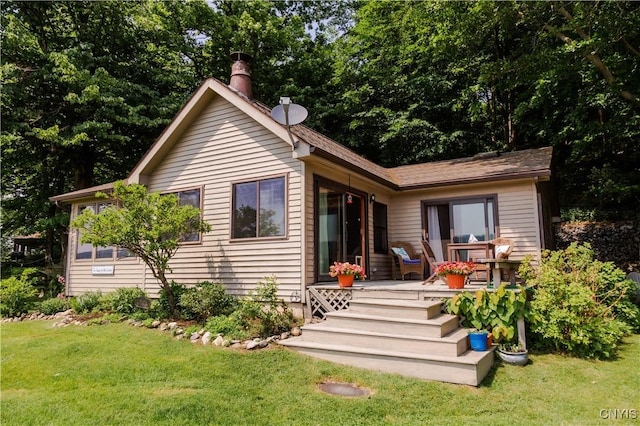 3271 Lanning Rd, Spafford, NY 13152 - rear view of house with a lawn, a chimney, and a wooden deck