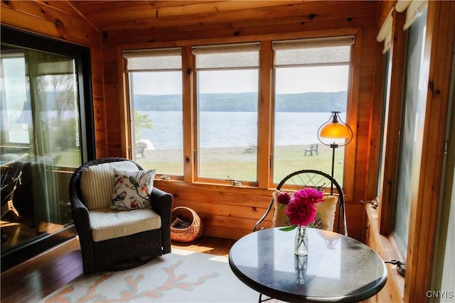 3271 Lanning Rd, Spafford, NY 13152 - sunroom / solarium with healthy amount of natural light, a water view, wood walls, and wood finished floors