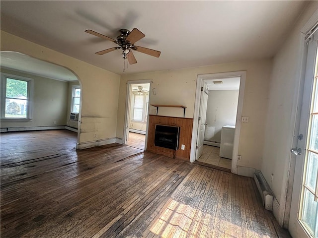 55 Maple St, Canisteo, NY 14823 - unfurnished living room featuring wood-type flooring, ceiling fan, baseboard heating, and arched walkways
