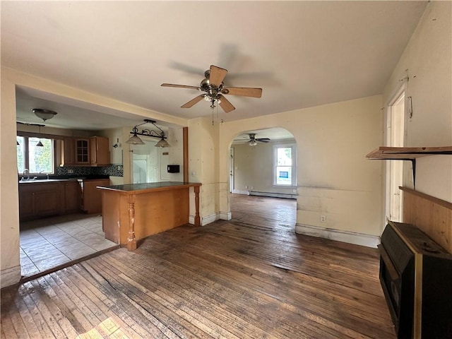 55 Maple St, Canisteo, NY 14823 - kitchen with dark countertops, light wood-type flooring, and plenty of natural light