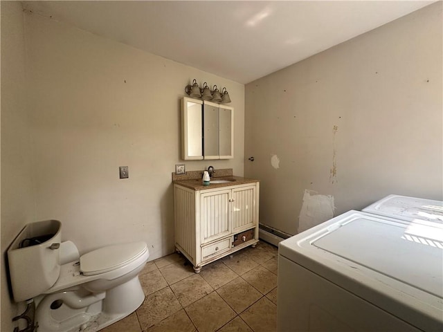 55 Maple St, Canisteo, NY 14823 - laundry area with light tile patterned floors and a baseboard radiator