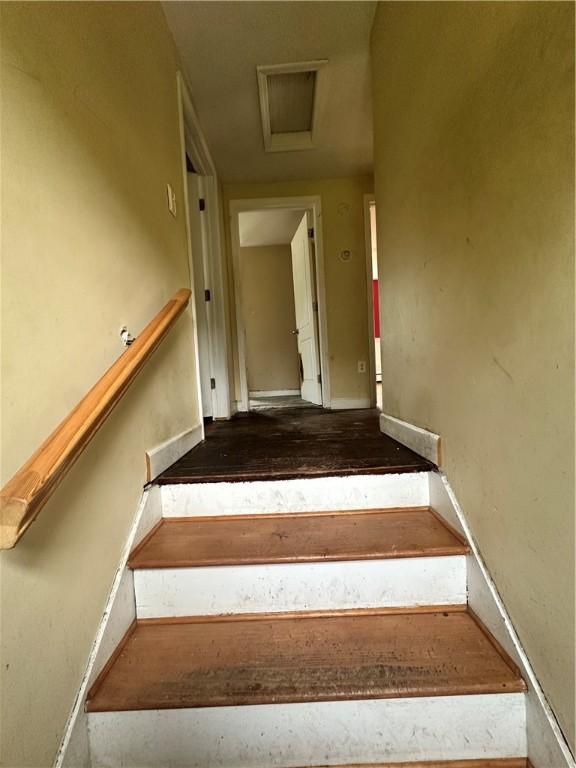 55 Maple St, Canisteo, NY 14823 - stairway featuring attic access and baseboards