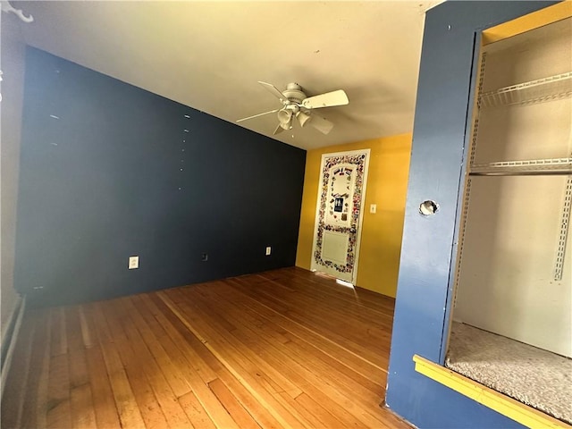 55 Maple St, Canisteo, NY 14823 - unfurnished bedroom with wood-type flooring, a closet, and ceiling fan