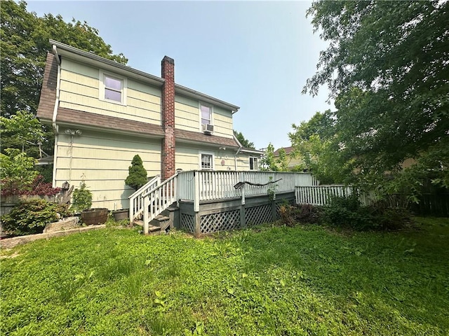 55 Maple St, Canisteo, NY 14823 - back of property featuring a deck, a chimney, a yard, and cooling unit