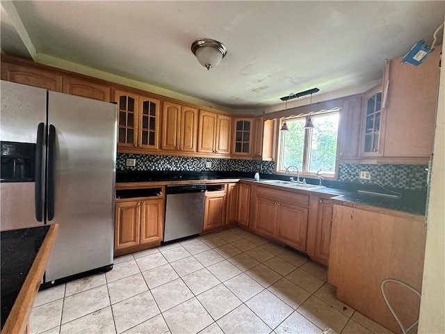 55 Maple St, Canisteo, NY 14823 - kitchen with stainless steel appliances, glass insert cabinets, decorative backsplash, and brown cabinets