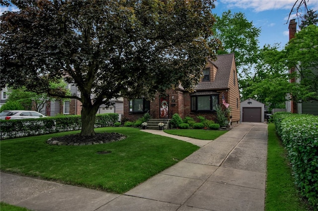 847 Starin Ave, Tonawanda-Town, NY 14223 - view of property hidden behind natural elements featuring brick siding, a detached garage, an outbuilding, and a front yard