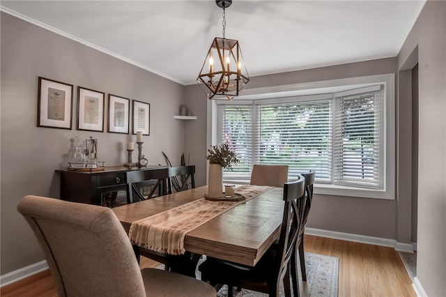 847 Starin Ave, Tonawanda-Town, NY 14223 - dining space featuring a chandelier, wood finished floors, and crown molding