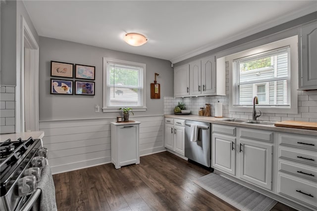 847 Starin Ave, Tonawanda-Town, NY 14223 - kitchen featuring stainless steel appliances, light countertops, dark wood-type flooring, backsplash, and a wainscoted wall