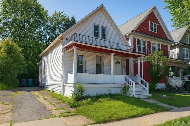 165 Leroy Ave, Buffalo, NY 14214 - view of front of property with a porch, a balcony, and a front yard