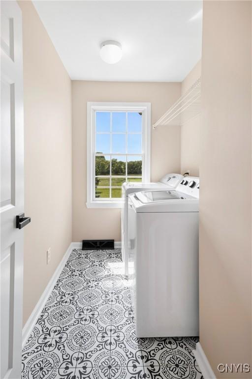 4244 County Line Rd, Skaneateles, NY 13152 - washroom with washer and dryer and light tile patterned floors