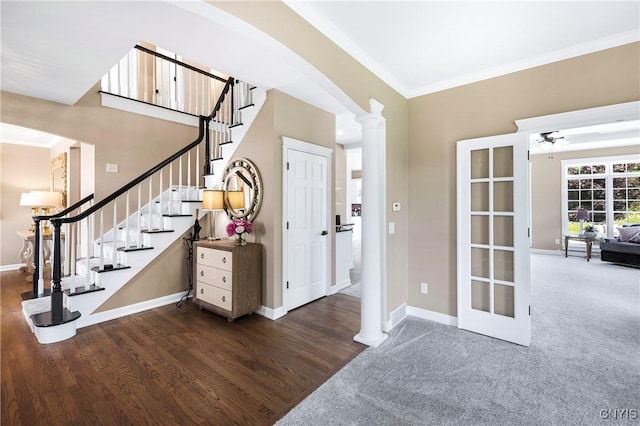 4244 County Line Rd, Skaneateles, NY 13152 - foyer featuring ornamental molding, decorative columns, stairway, wood finished floors, and arched walkways