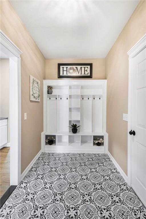 4244 County Line Rd, Skaneateles, NY 13152 - mudroom featuring baseboards