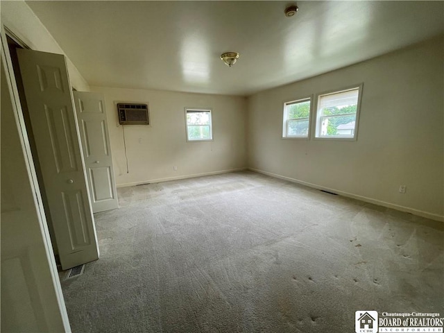 102 Broadhead Ave, Jamestown, NY 14701 - carpeted spare room featuring a wall mounted AC and a smoke detector