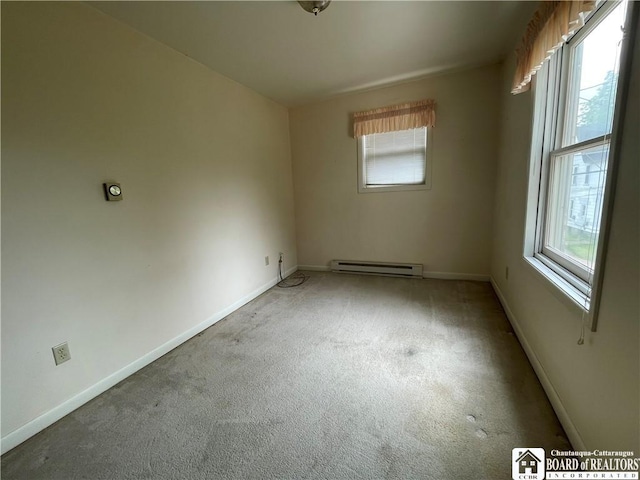 102 Broadhead Ave, Jamestown, NY 14701 - carpeted empty room featuring a baseboard heating unit and plenty of natural light