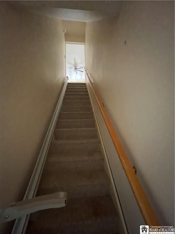 102 Broadhead Ave, Jamestown, NY 14701 - stairway featuring baseboards and carpet floors