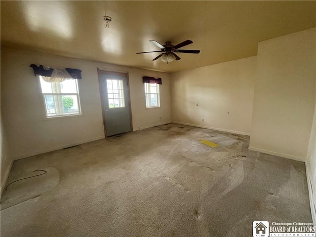 102 Broadhead Ave, Jamestown, NY 14701 - carpeted empty room with healthy amount of natural light and ceiling fan