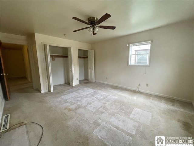 102 Broadhead Ave, Jamestown, NY 14701 - unfurnished bedroom with two closets, light carpet, and a ceiling fan