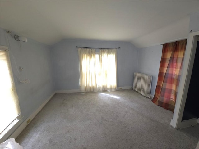 17 Lake St, Mount Morris, NY 14510 - unfurnished bedroom featuring radiator heating unit, lofted ceiling, and carpet