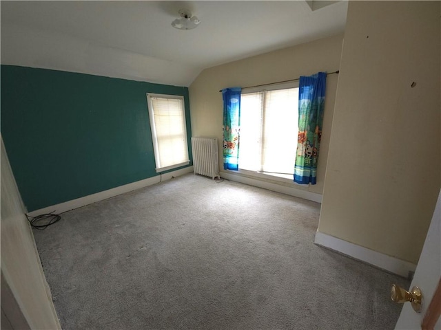 17 Lake St, Mount Morris, NY 14510 - carpeted empty room with radiator and vaulted ceiling