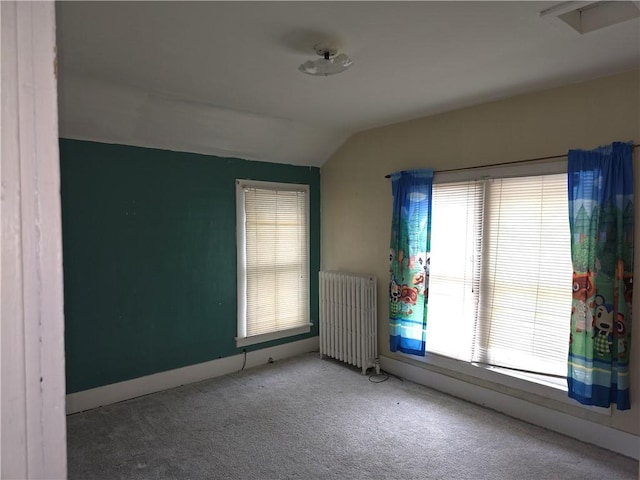 17 Lake St, Mount Morris, NY 14510 - unfurnished room with radiator, lofted ceiling, and carpet flooring