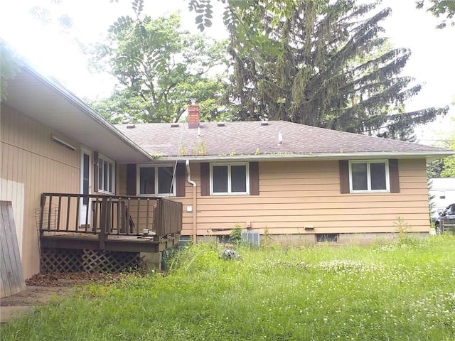 6 Newport Rd, Irondequoit, NY 14622 - back of property featuring a wooden deck, a chimney, and a shingled roof