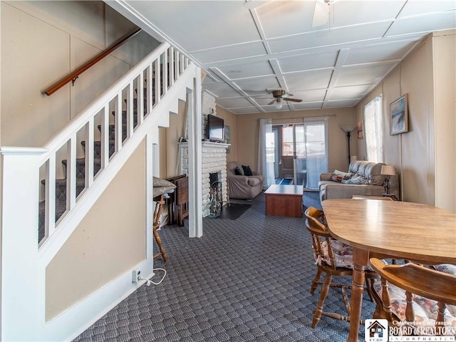 3971 Rte 430, Ellery, NY 14712 - dining area featuring ceiling fan, a fireplace, and dark carpet