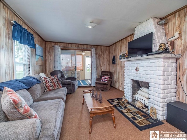 3971 Rte 430, Ellery, NY 14712 - living area featuring wooden walls, carpet floors, crown molding, and a fireplace