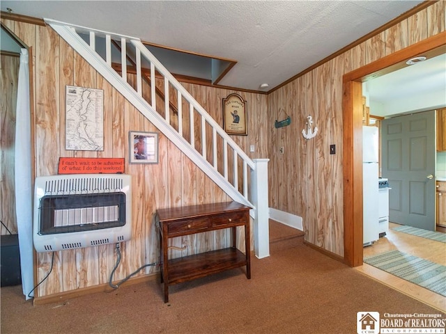 3971 Rte 430, Ellery, NY 14712 - staircase with heating unit, wooden walls, carpet flooring, ornamental molding, and a textured ceiling