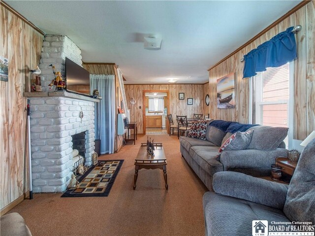 3971 Rte 430, Ellery, NY 14712 - living area featuring wood walls, carpet floors, and a brick fireplace
