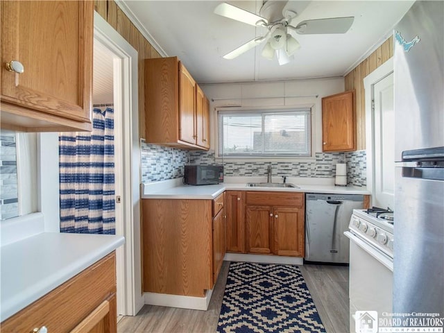3971 Rte 430, Ellery, NY 14712 - kitchen with stainless steel appliances, tasteful backsplash, light countertops, and light wood finished floors