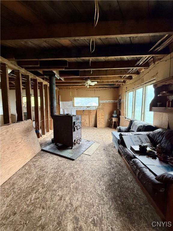 301 Pigeon Hill Rd, Plymouth, NY 13844 - basement featuring a wood stove and wooden ceiling