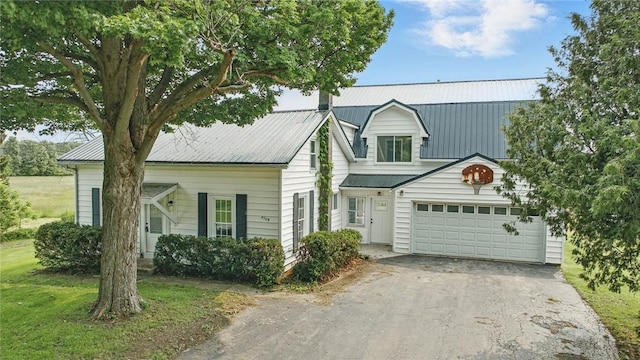 4709 Freeman Rd, Royalton, NY 14105 - view of front of house featuring driveway, an attached garage, and a metal roof