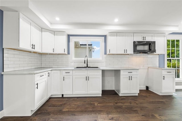 4709 Freeman Rd, Royalton, NY 14105 - kitchen with black microwave, dark wood-style flooring, white cabinetry, recessed lighting, and decorative backsplash