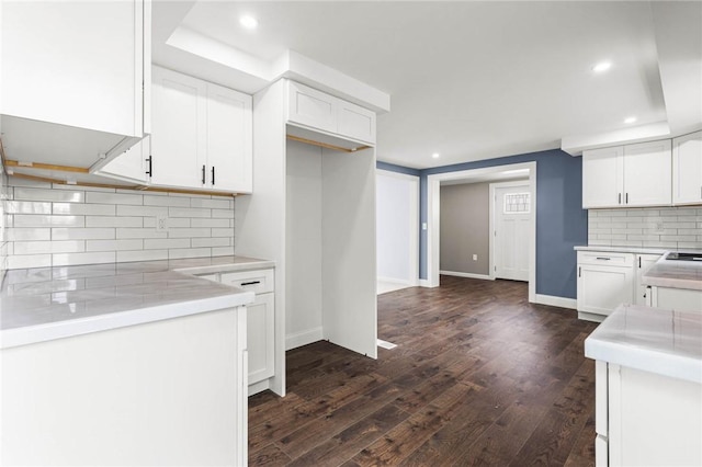 4709 Freeman Rd, Royalton, NY 14105 - kitchen with white cabinets, recessed lighting, dark wood-style flooring, decorative backsplash, and light countertops