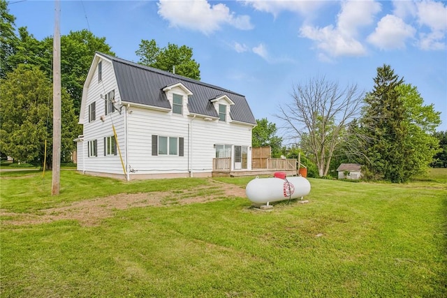 4709 Freeman Rd, Royalton, NY 14105 - rear view of property featuring a metal roof, a wooden deck, and a yard