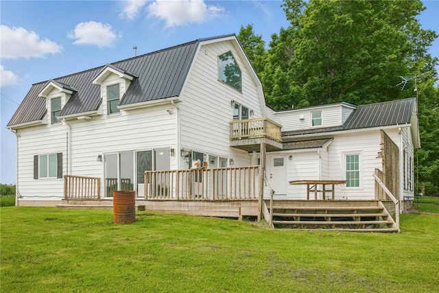 4709 Freeman Rd, Royalton, NY 14105 - back of house with a metal roof, a lawn, a balcony, and a wooden deck