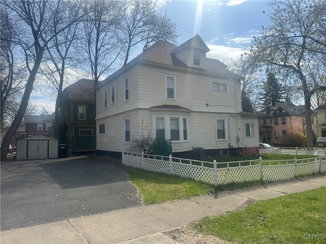 101 Avondale Pl, Syracuse, NY 13210 - view of front of house with a shed, a fenced front yard, and driveway