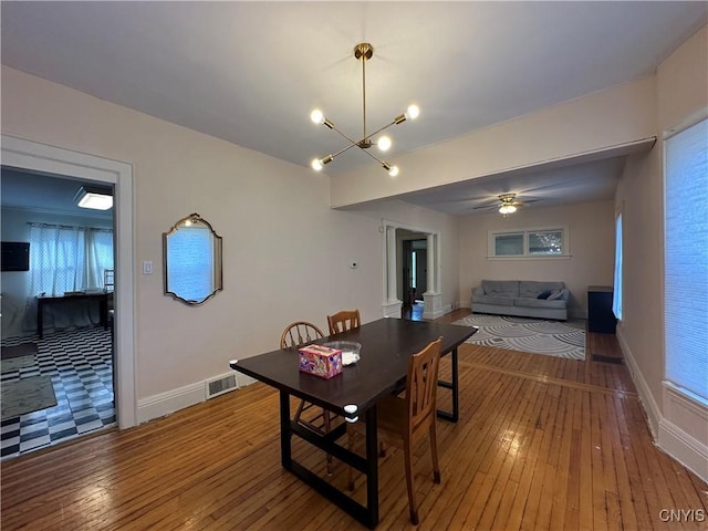101 Avondale Pl, Syracuse, NY 13210 - dining room featuring hardwood / wood-style floors, a chandelier, and ceiling fan