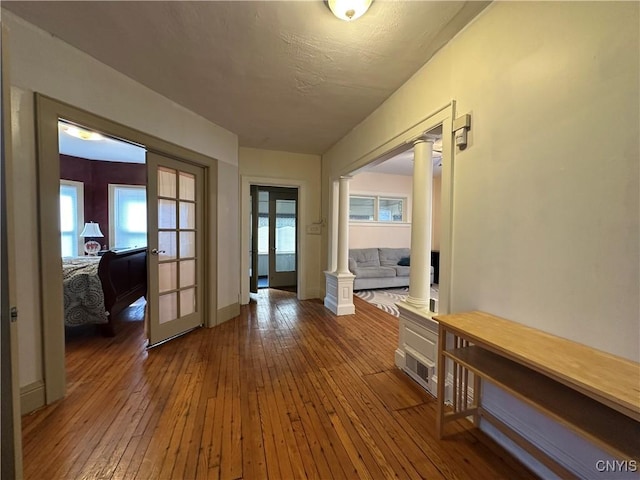 101 Avondale Pl, Syracuse, NY 13210 - hallway featuring ornate columns, hardwood / wood-style floors, and french doors
