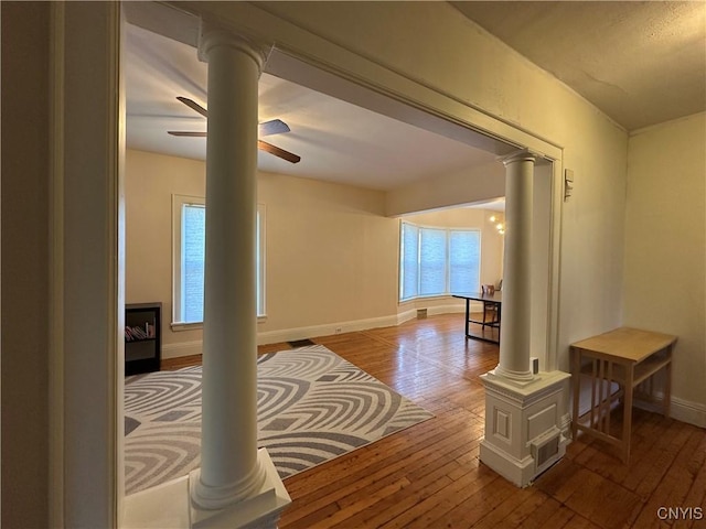 101 Avondale Pl, Syracuse, NY 13210 - hallway featuring ornate columns, wood-type flooring, and plenty of natural light