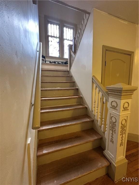 101 Avondale Pl, Syracuse, NY 13210 - stairs featuring baseboards and wood finished floors