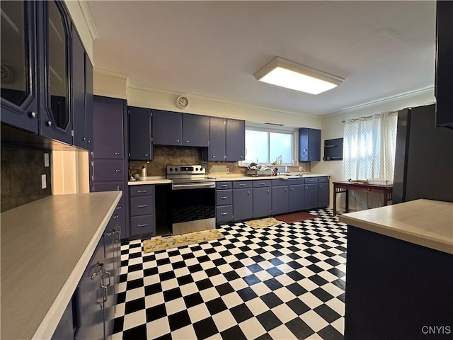 101 Avondale Pl, Syracuse, NY 13210 - kitchen with appliances with stainless steel finishes, light floors, light countertops, and decorative backsplash