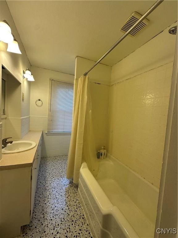 101 Avondale Pl, Syracuse, NY 13210 - bathroom featuring vanity, shower / tub combo with curtain, and tile walls